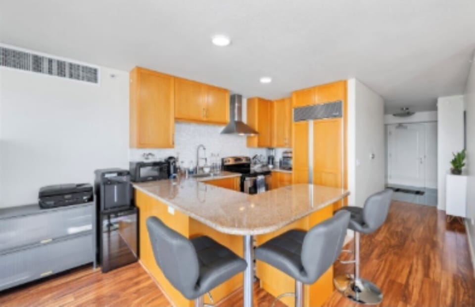 Bar seats and kitchen