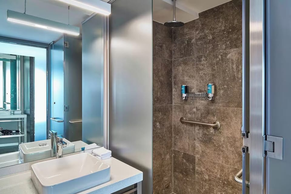 Rinse off in a roomy walk-in shower with rainfall head.