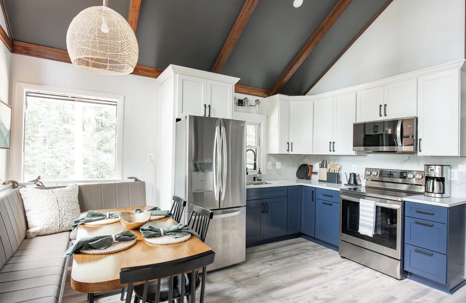 Whether you're cooking slow meals or sharing stories over dinner, the fully-stocked kitchen and dining area was designed for connection, comfort, and quiet moments that nourish.