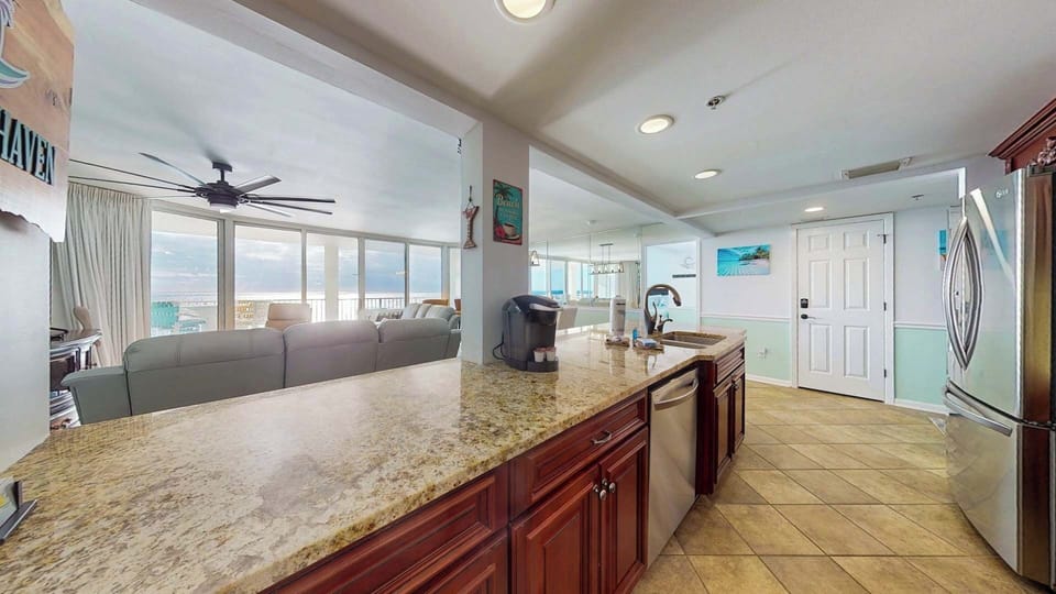 Large Kitchen overlooking the Living area and Gulf with everything you need to prepare meals and snacks!