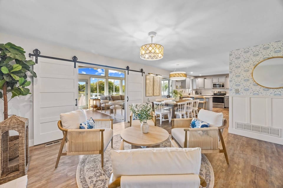 A second sitting room is nestled between the family room and kitchen table.