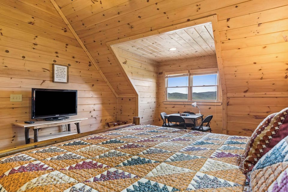 This king bedroom is more than just a place to sleep—kick back with your favorite show on the smart TV or sip coffee at the cozy table and chairs. Comfort meets convenience! 