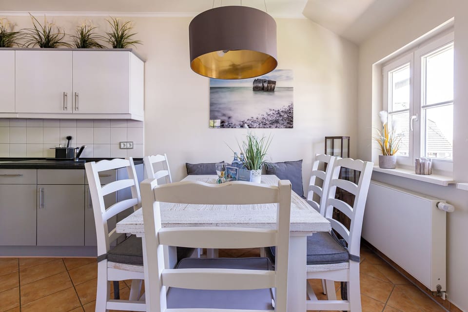 Modern Kitchen with Dining Table and Plants
