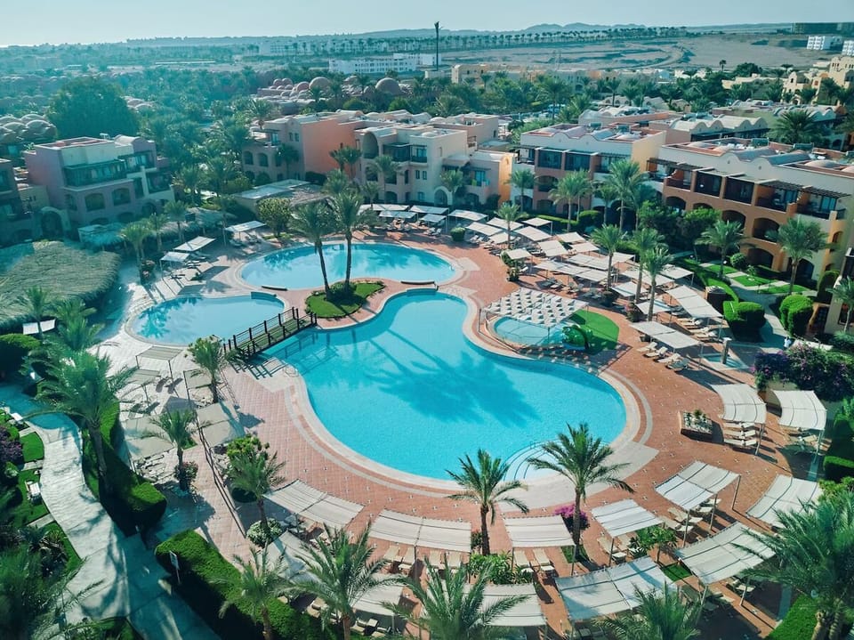Soak up sunshine with panoramic views of the pool complex.