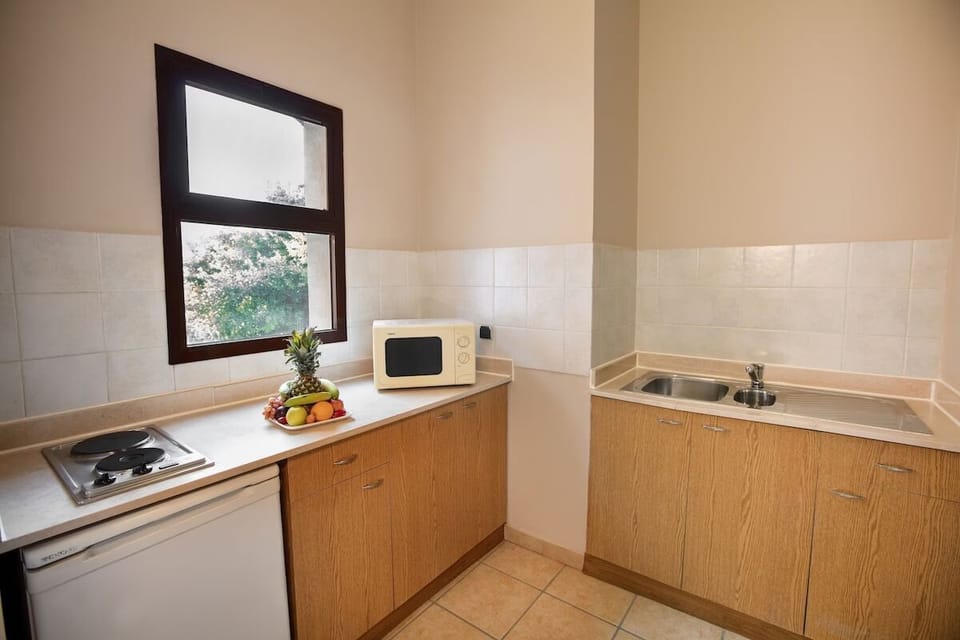Whip up easy meals with handy kitchenette and bright window.
