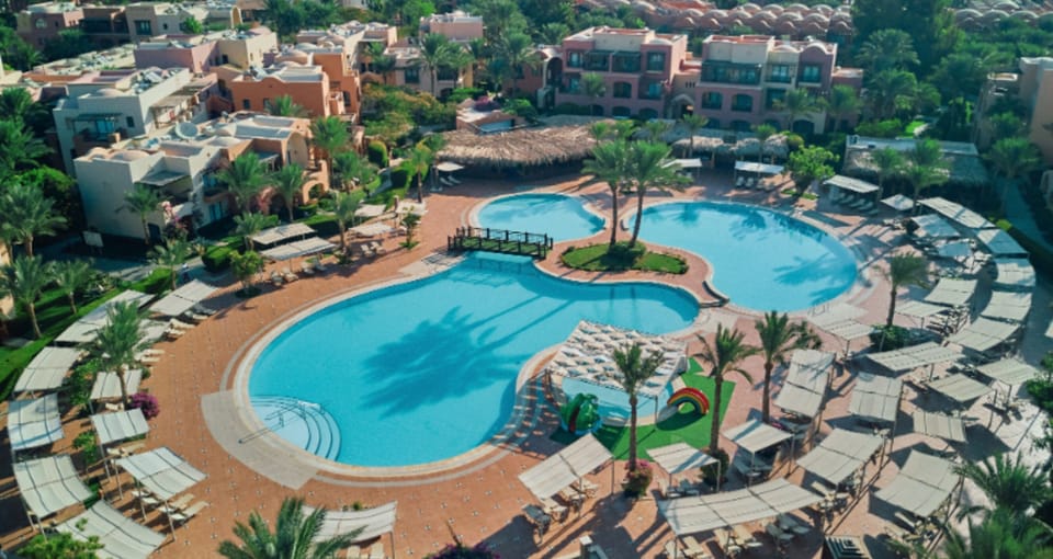 Glide over the resort pools and sun-soaked terraces below.