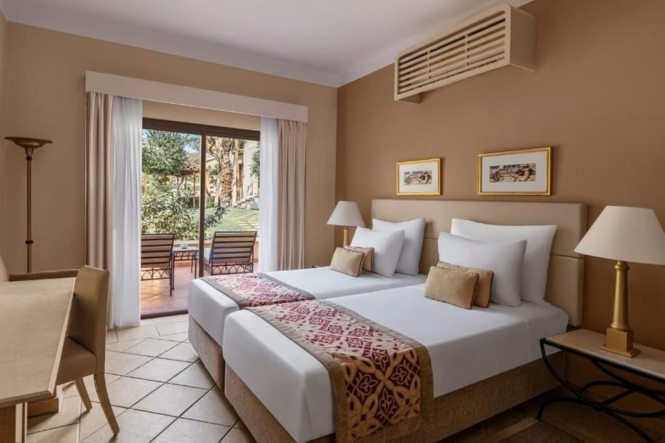 Unwind in twin comfort with garden patio just outside.