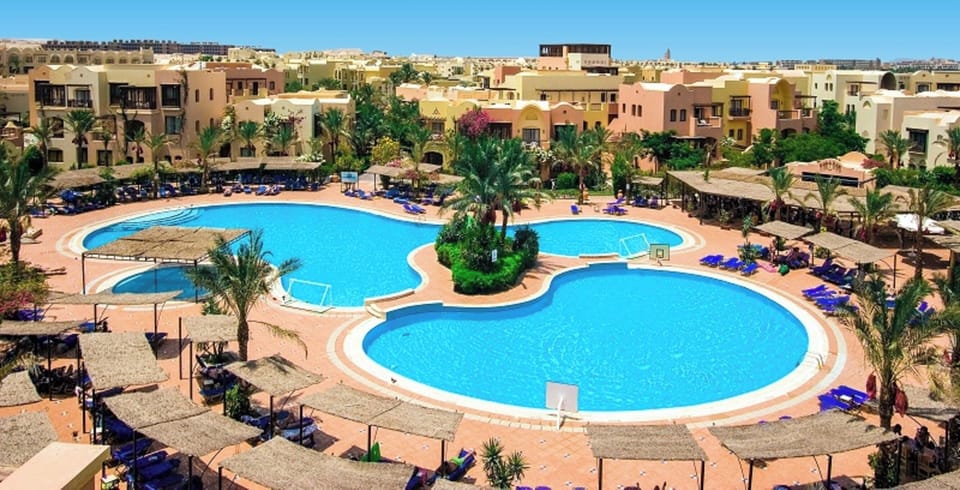 Dive into sparkling lagoon pools surrounded by sun loungers.