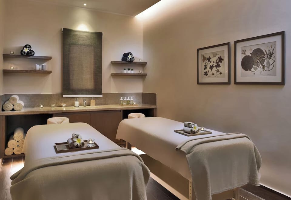 Indulge in soothing spa rituals on plush, tranquil massage beds.