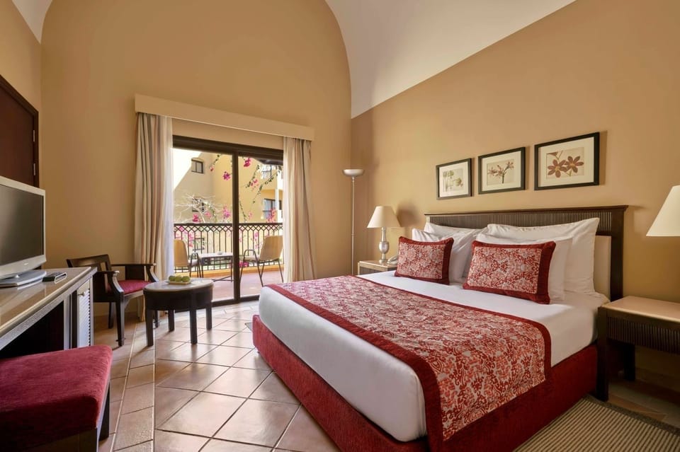 Stretch out on the king bed under airy vaulted ceilings.