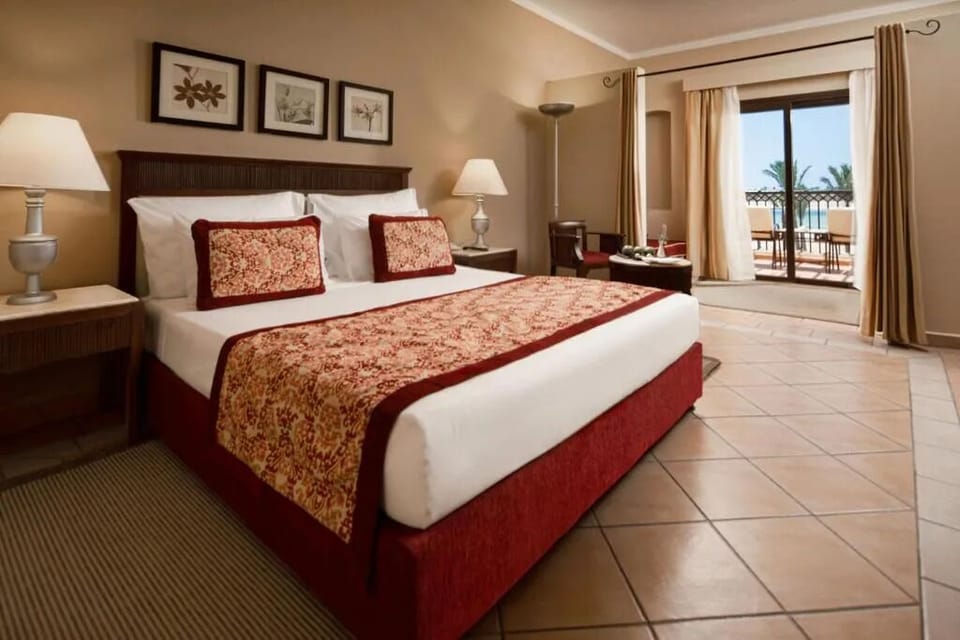 Wake up refreshed in a plush king bed near the balcony.