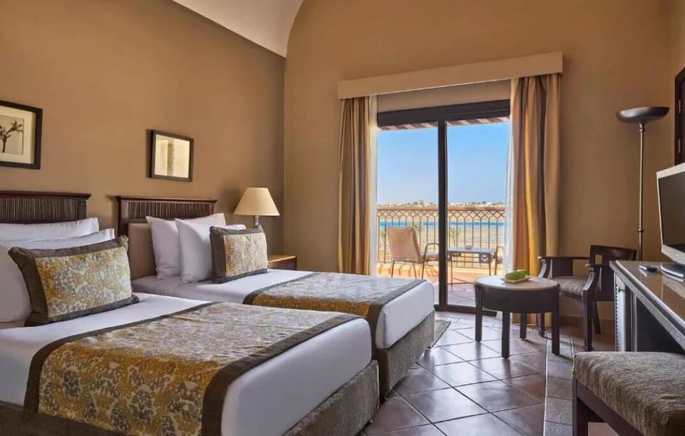 Enjoy coffee by the balcony after a restful twin-bed night.