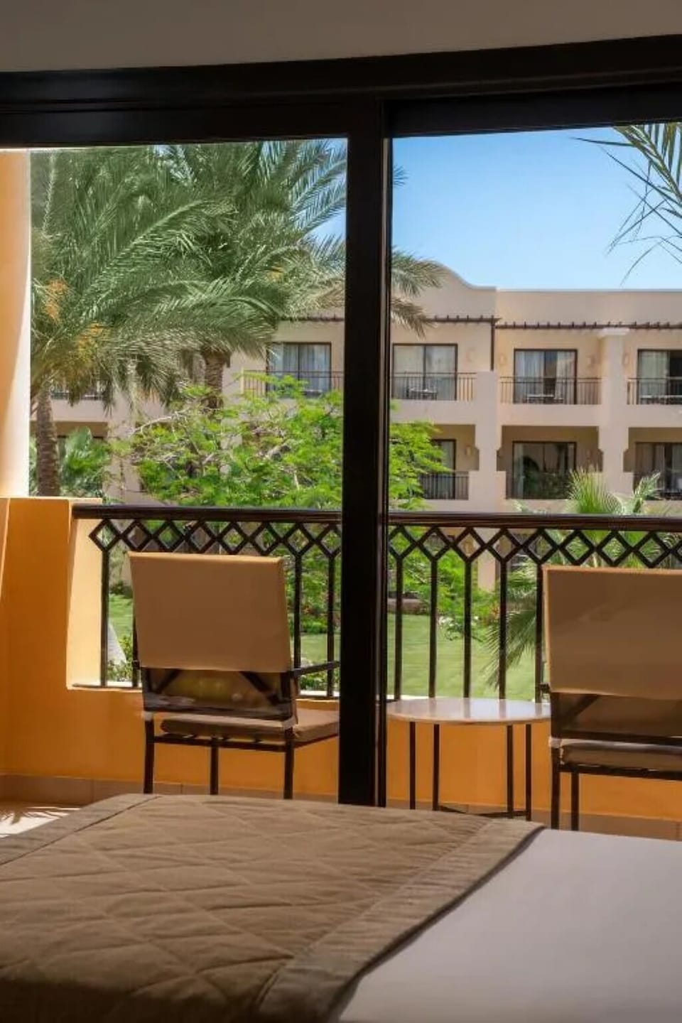 Sip morning coffee on the balcony overlooking lush gardens.