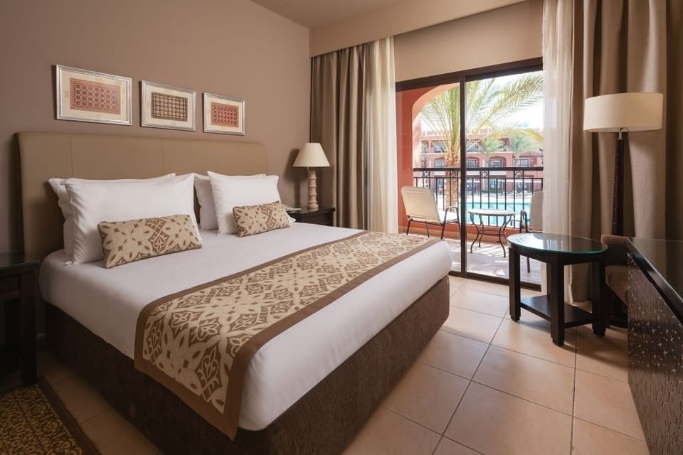 Wake up to sunshine and balcony views over the pool.