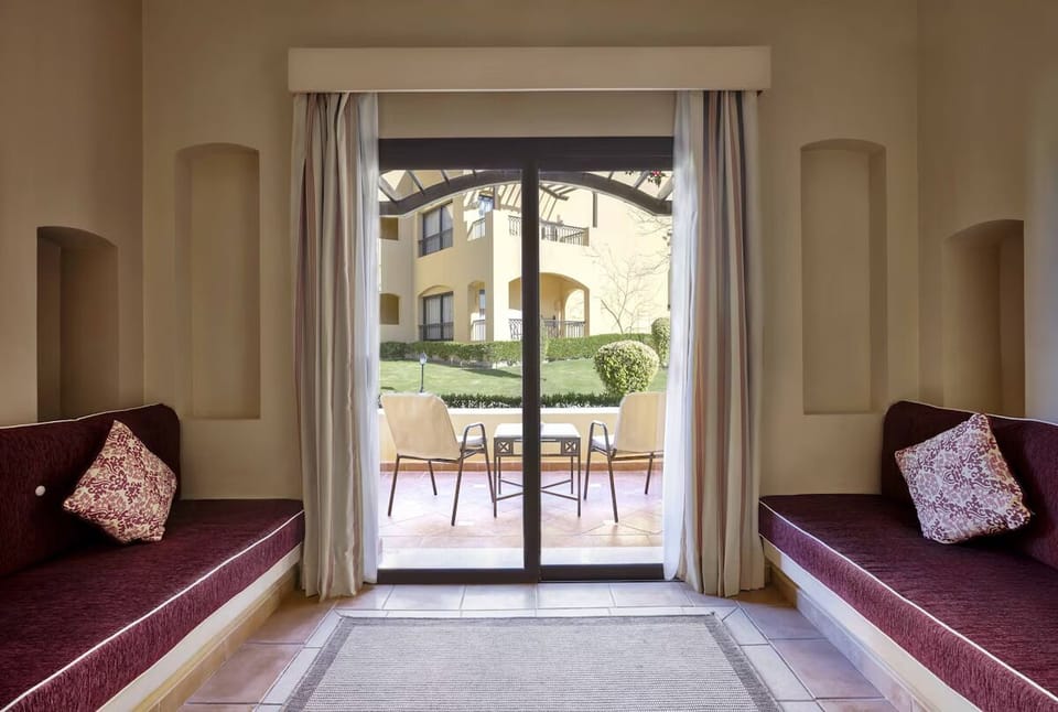 Lounge on built-in daybeds and sip coffee by the terrace.