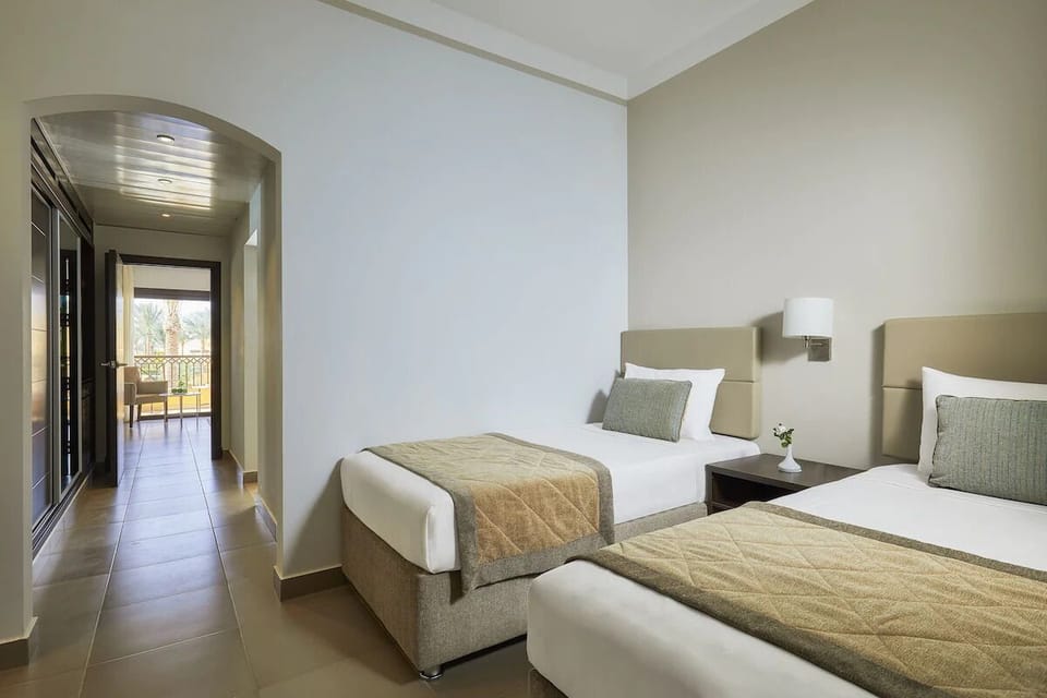 Stretch out in airy comfort with an inviting terrace beyond.