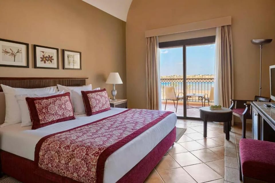 Drift off in plush comfort with sparkling sea views outside.