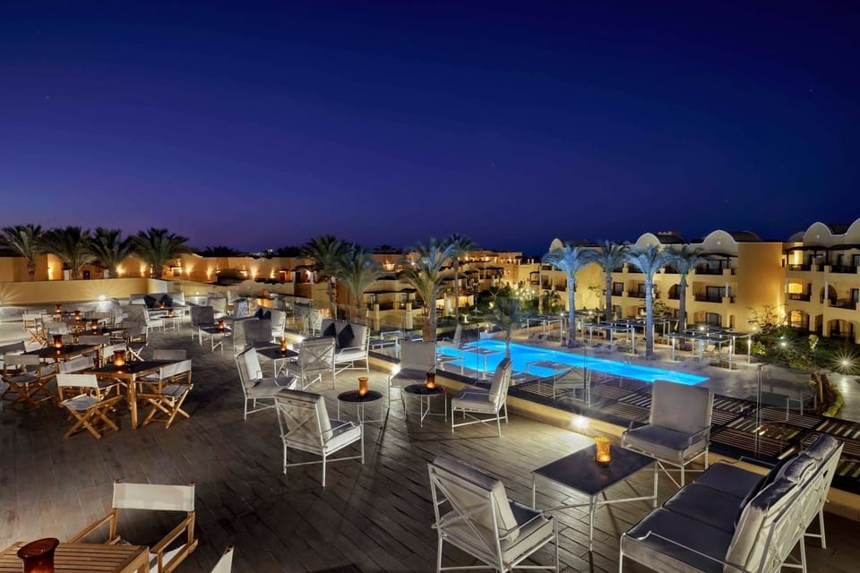 Unwind under starry skies by the glowing rooftop pool.