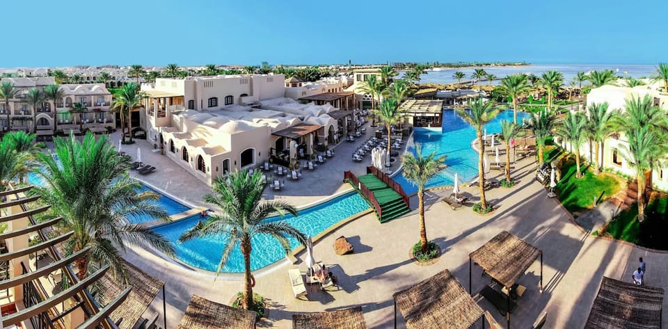 Wander sunlit paths between pools, gardens, and airy courtyards.