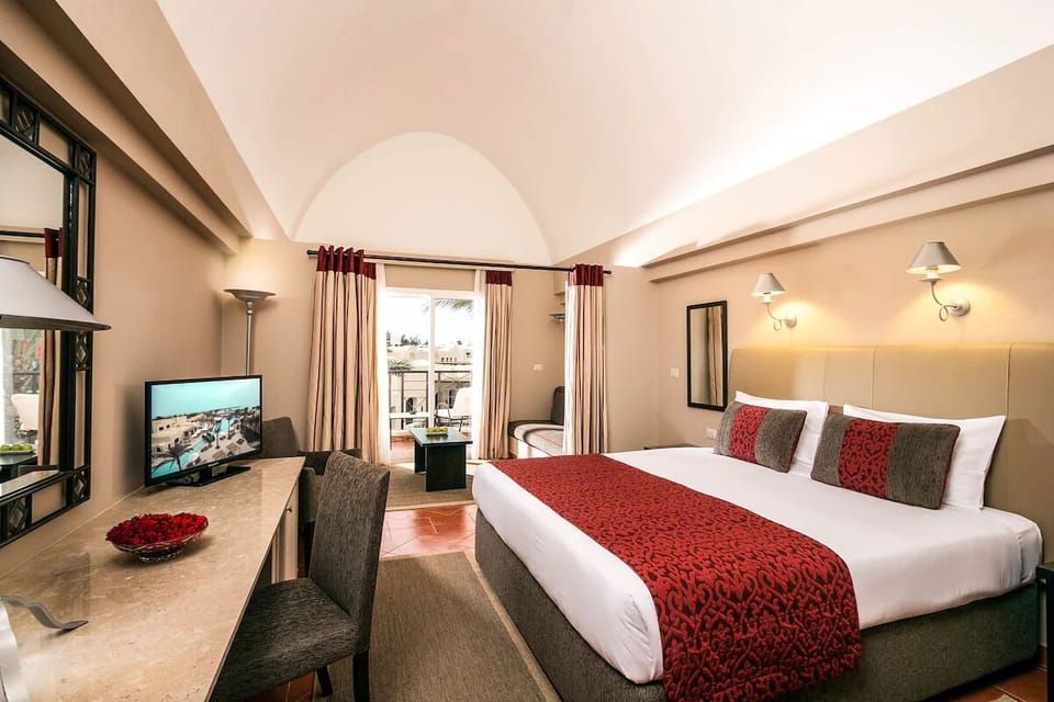 Stretch out on plush bedding beneath warm ambient lighting.