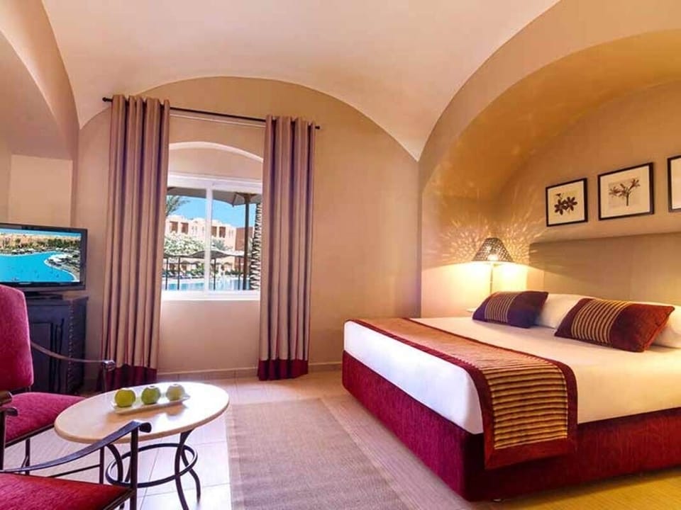 Sink into plush bedding and glow of soft evening light.