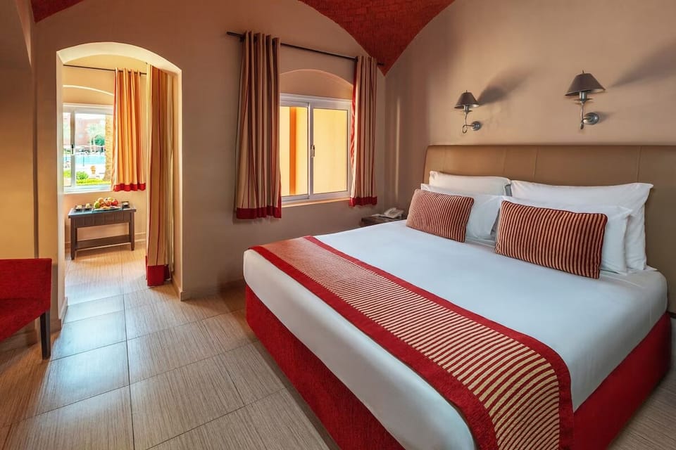 Drift off in a serene bedroom with warm sunset tones.