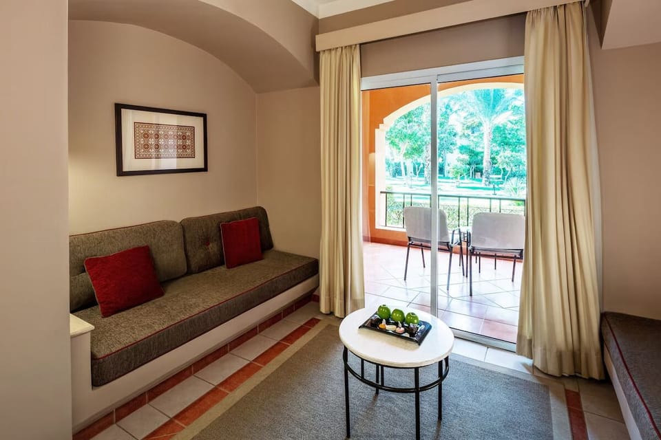Living area. Exact unit will be assigned upon arrival. Views, colors, and decor may vary.