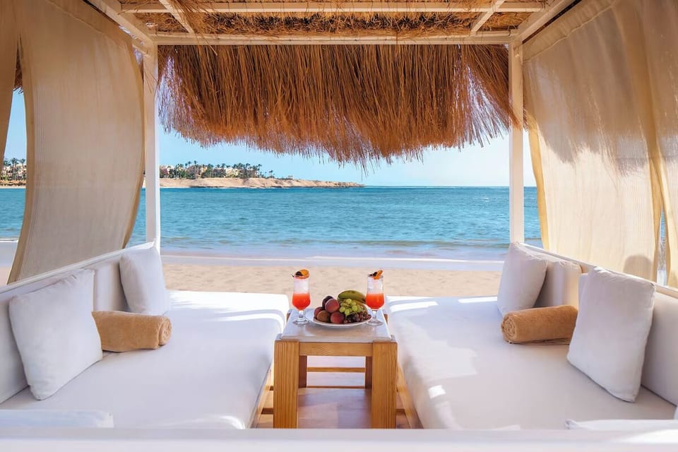 Stretch out seaside in a breezy cabana with fresh drinks.