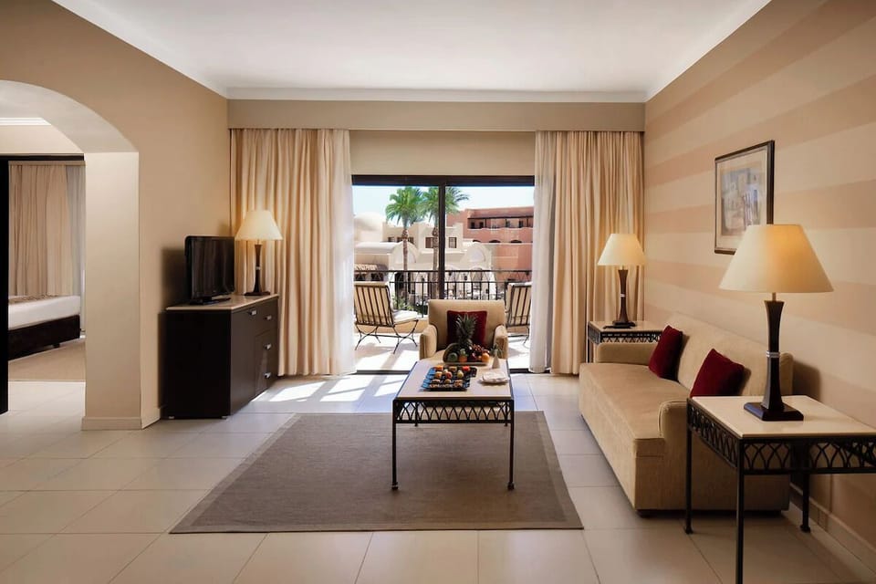 Gather in a sunlit suite lounge with balcony doors open.