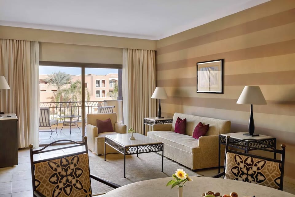 Stretch out on plush seating beside bright balcony views.