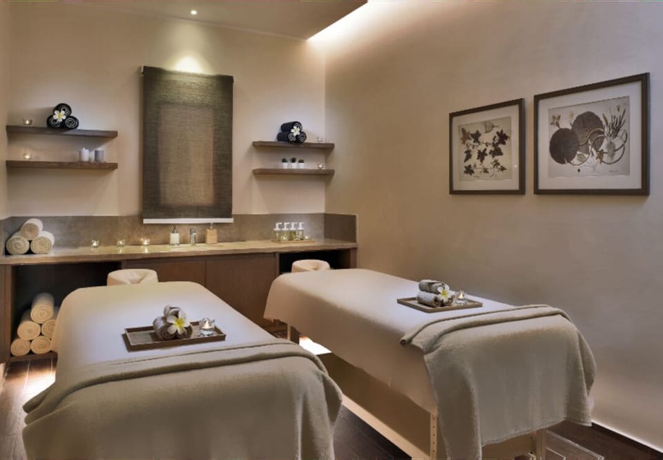 Unwind side-by-side with soothing spa rituals and soft lighting.