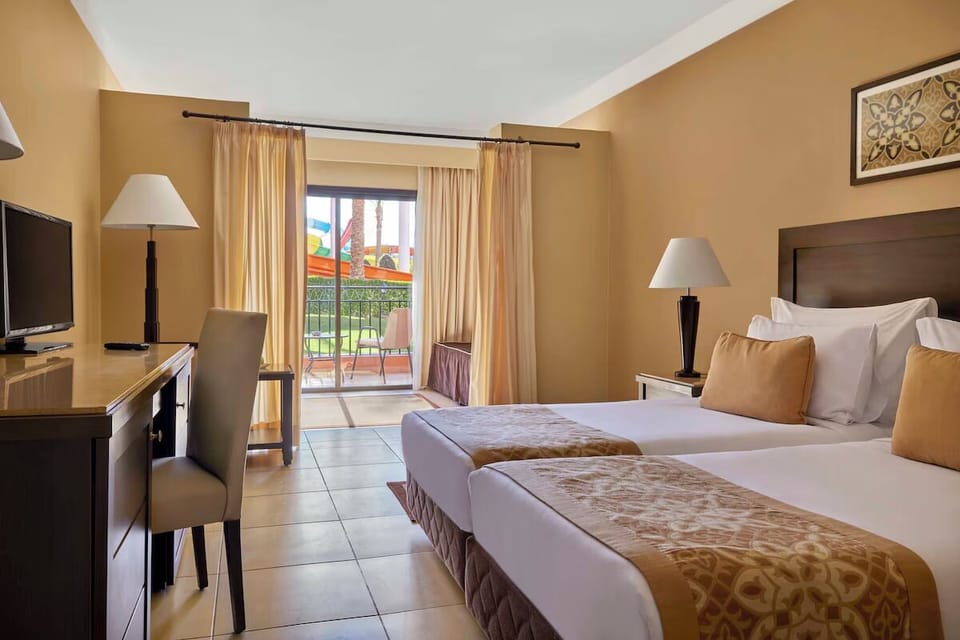 Settle into a bright twin room steps from the balcony.