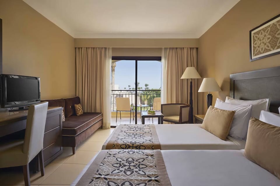 Unwind in twin comfort with balcony breezes and sunshine views.