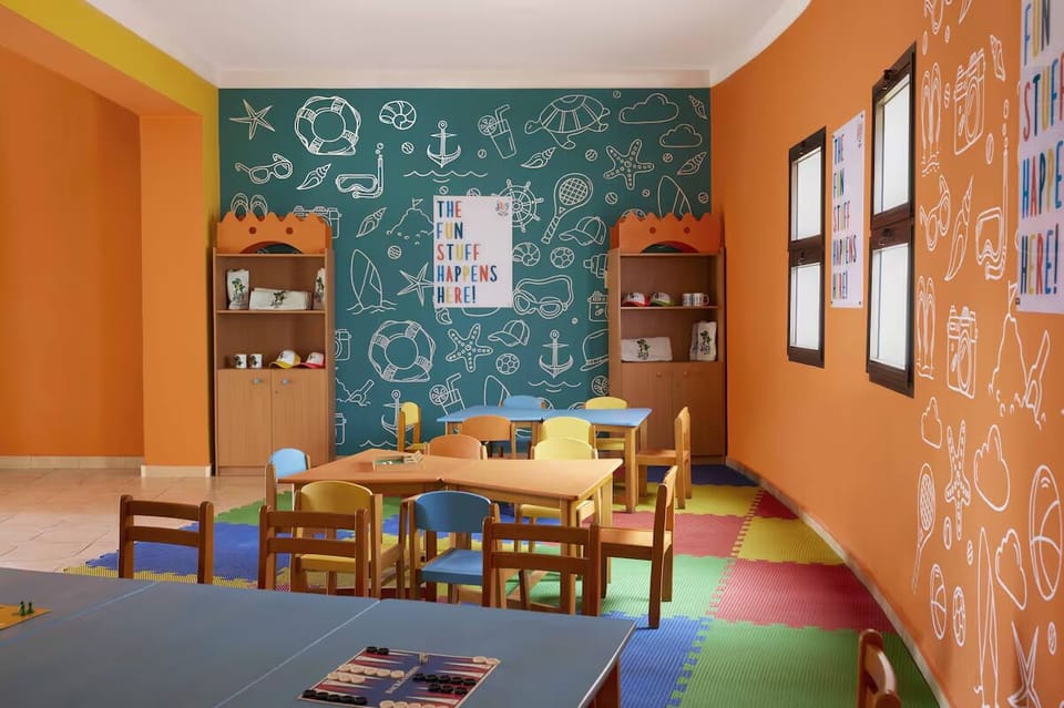 Spark creativity in the colorful kids’ playroom full of games.