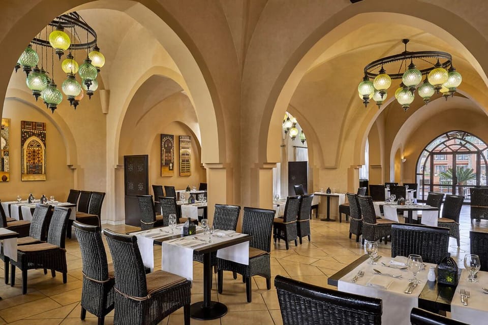 Savor an elegant meal beneath soaring arches and warm lanterns.
