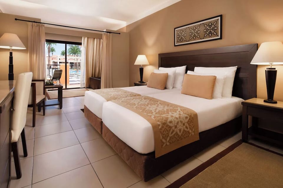 Sink into a king bed with serene resort-view balcony.