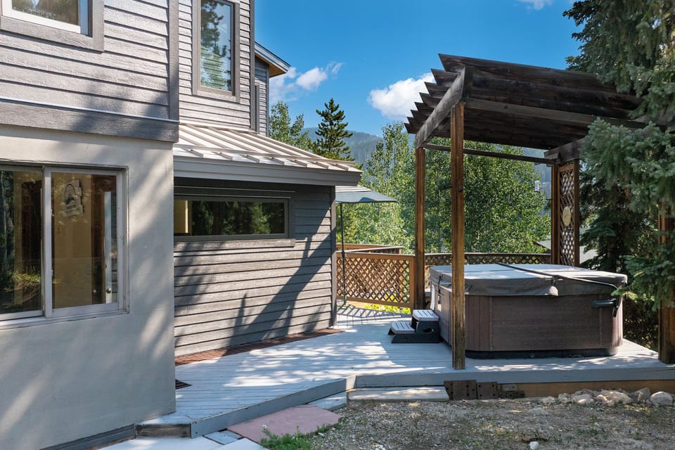 Unwind in your private hot tub on the spacious deck, surrounded by mountain views and forest tranquility.