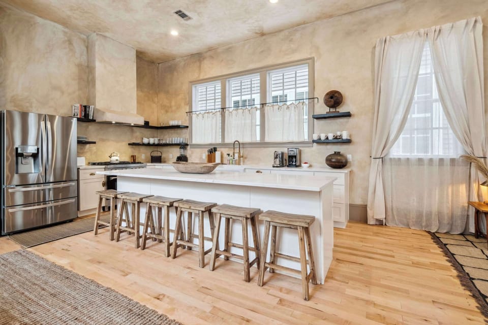 Fully Equipped Kitchen with Brand New Stainless Steel Appliances, Bar Seating and Natural Light