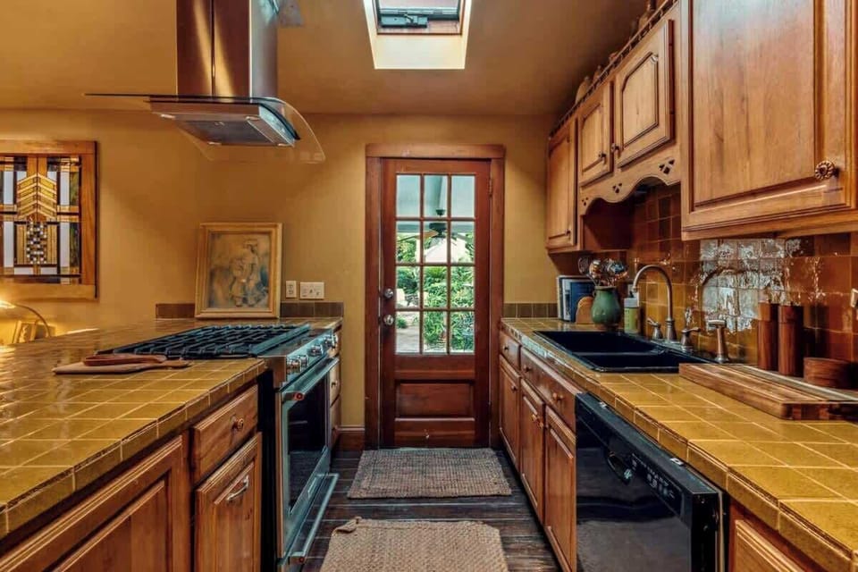 Fully Equipped Kitchen Adjacent to Living Area in Large House