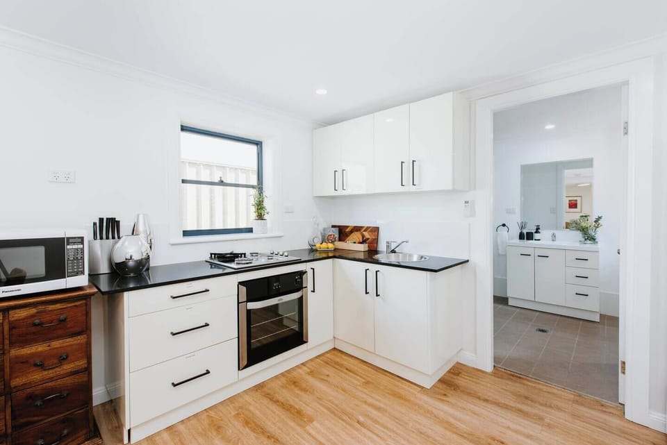 Enjoy use of the oven and stove, heat up a quick bite to eat in the microwave and store your groceries in the full-size fridge.