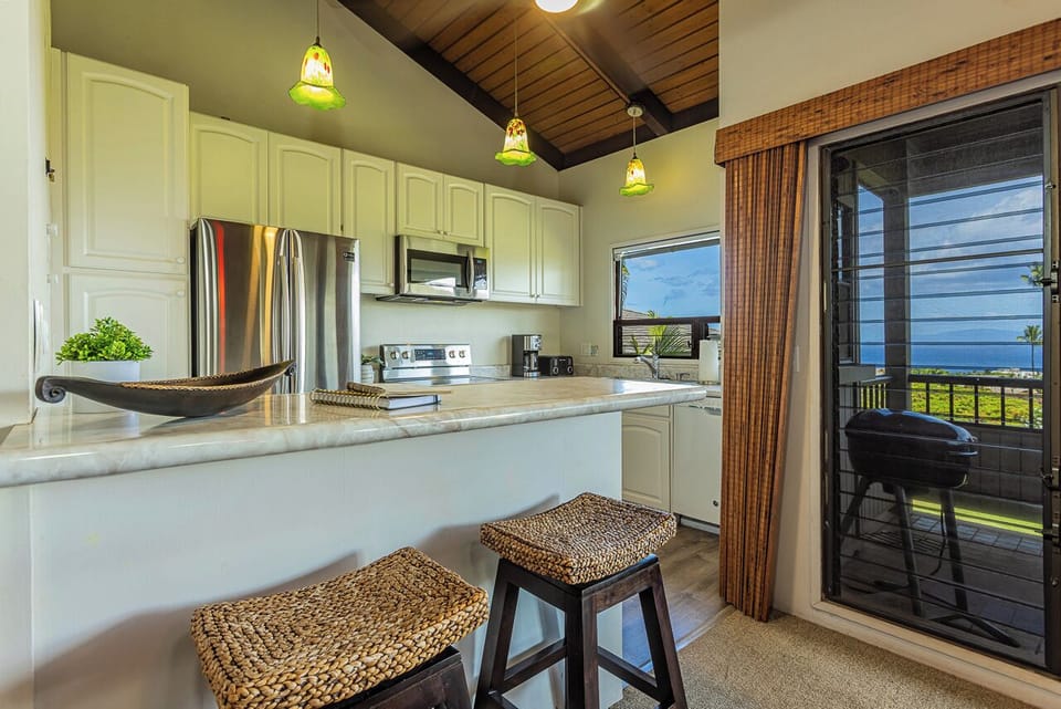 The open kitchen seamlessly connects to the living spaces, making gathering and entertaining easy.