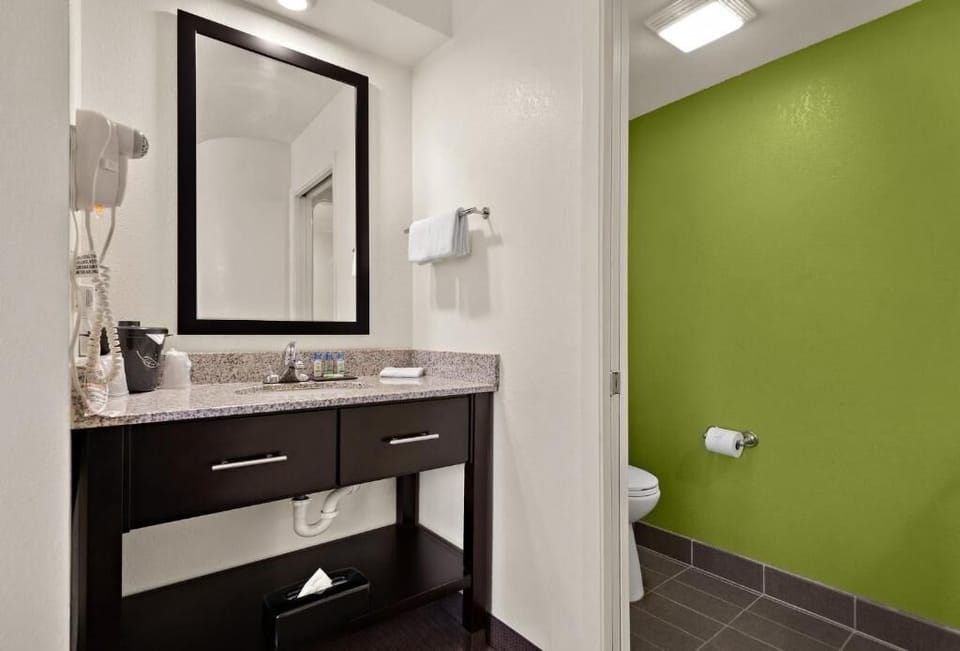 Refresh easily with a spacious vanity and bright lighting.
