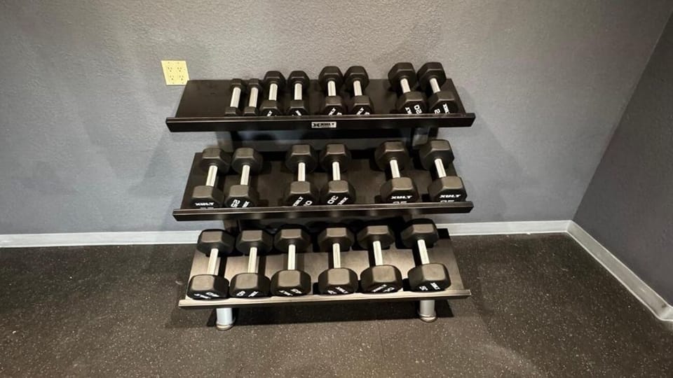 Build strength anytime with a full set of free weights.