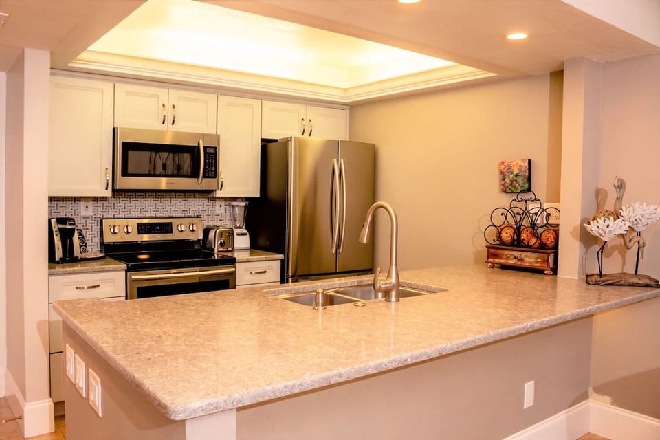 Serve cocktails and snacks across the expansive breakfast bar.