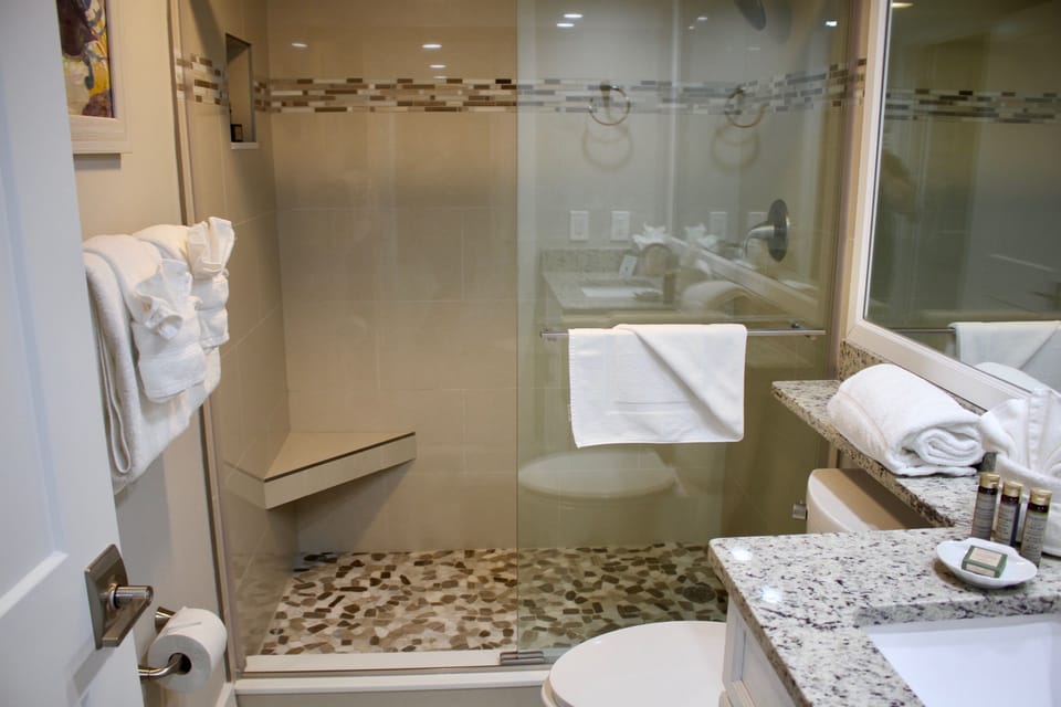 Refresh after the beach in a spotless glass-walled shower.