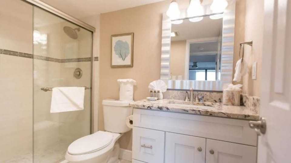 Refresh with a hot shower in a spotless, modern bath