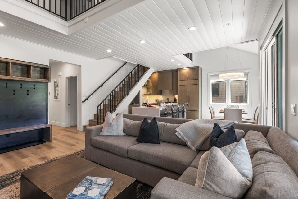 The open concept living area, kitchen, and dining area.