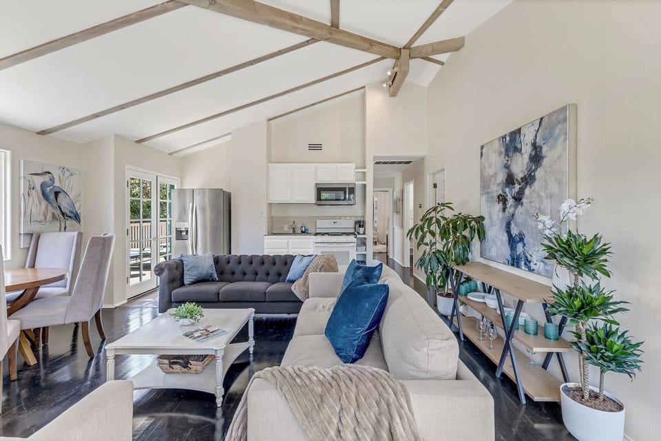 Relax in the open, airy living room after a day of exploring w/ plush furnishing