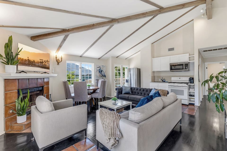 Relax in the open, airy living room after a day of exploring w/ plush furnishing