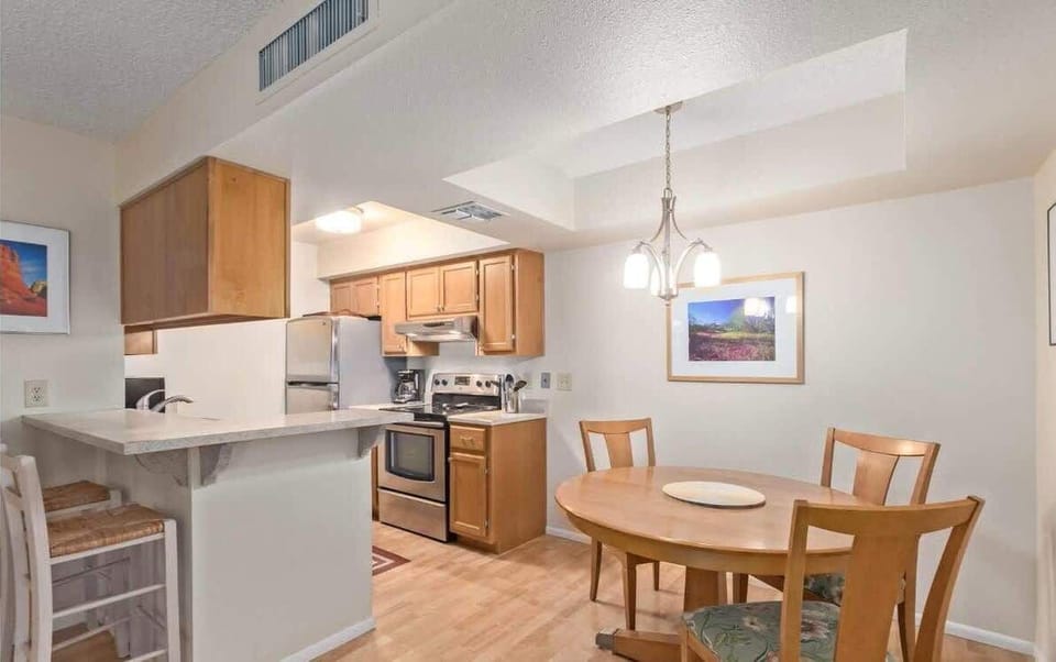 Share meals or play games at the cozy dining table for four.